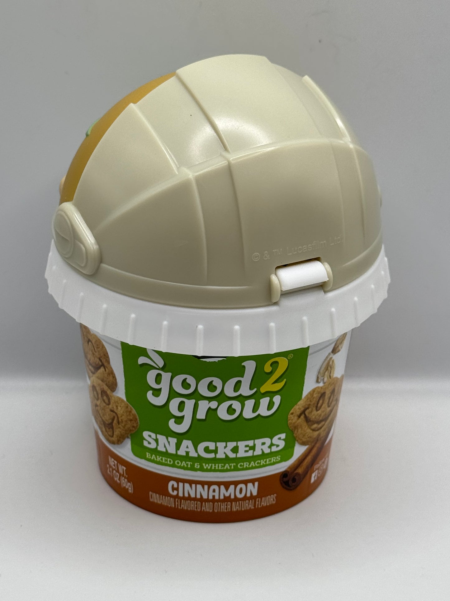 Good 2 Grow Snackers Baked Wheat & Oat Crackers Chocolate or Cinnamon with reusable snack tub and character head lid.